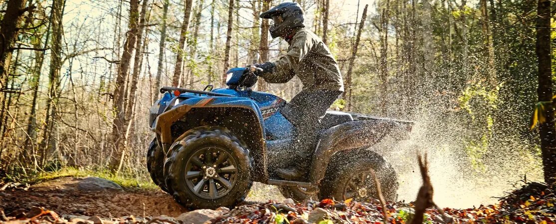 ATV rider on back trails in the wilderness